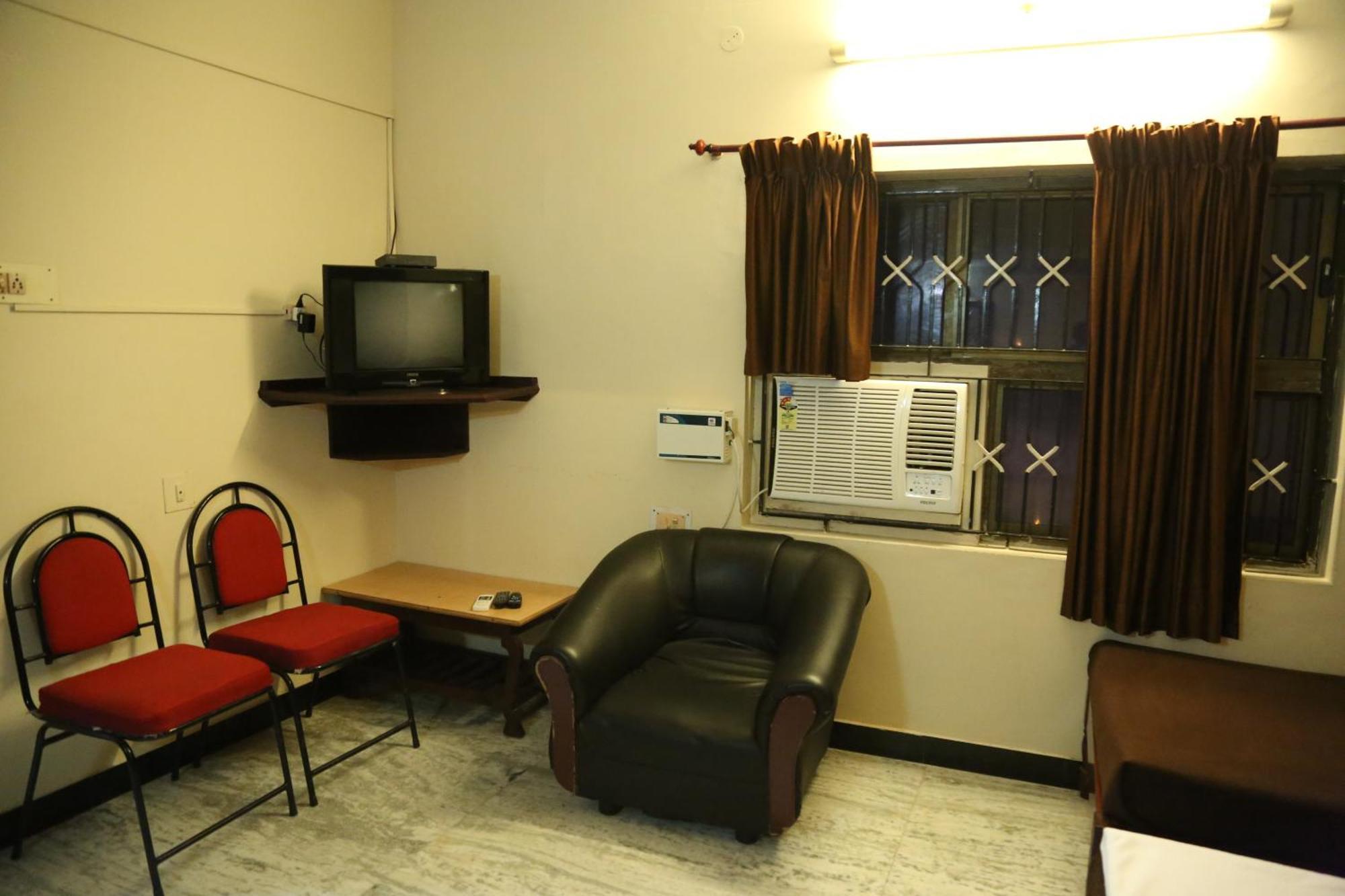 Rmc travellers inn Chennai Rom bilde